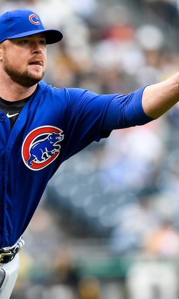 Cubs pitcher Jon Lester is still throwing his entire glove to first base